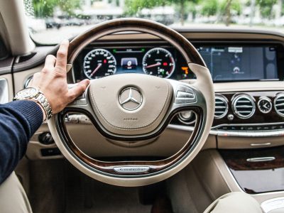 person sitting in Mercedes-Benz driver seat